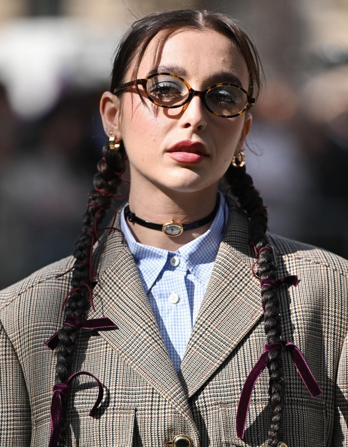 Emma Chamberlain wearing a Cartier Baignoire gold watch as a necklace