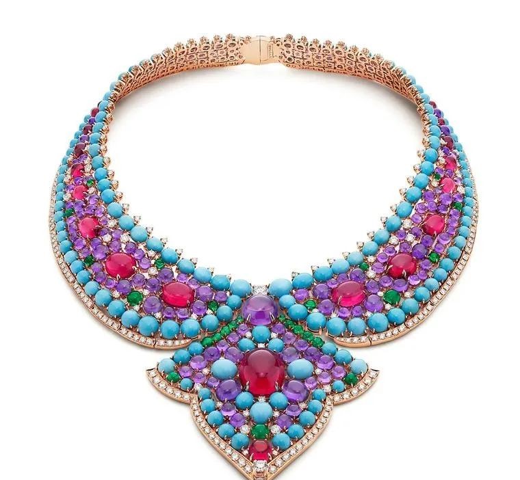 In Bvlgari's Lotus Cabochon necklace, turquoise, emerald, ruby, and amethyst cabochons are arranged in a bib against Bvlgari's pavé style, creating a pebble-like effect.
