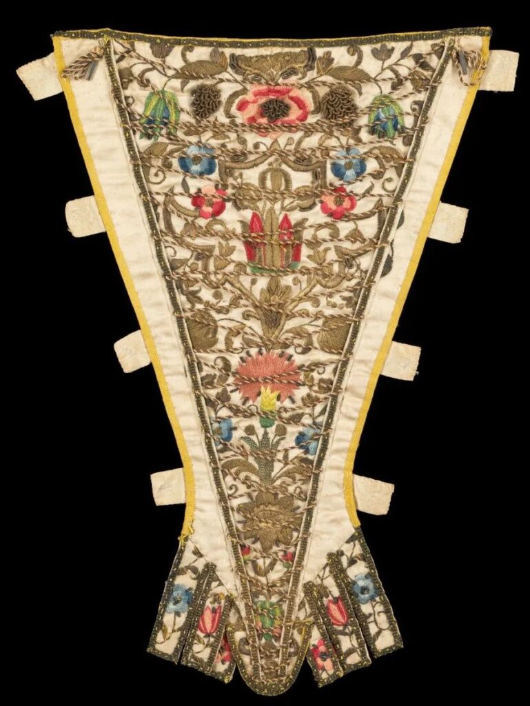 Different styles of triangular stomachers