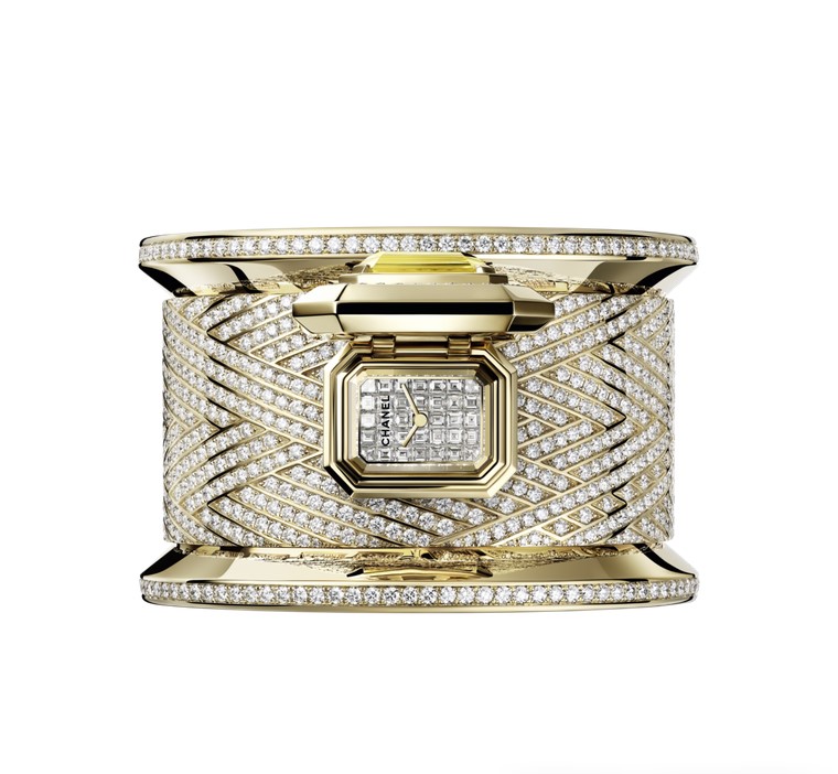 Chanel's Bobbin Cuff Couture, inspired by a bracelet, is a unique piece that conceals a watch dial beneath an emerald-cut yellow sapphire surrounded by diamonds.