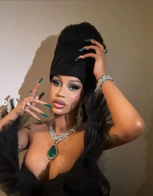 Cardi B wearing Kamyen Jewelry emerald jewelry