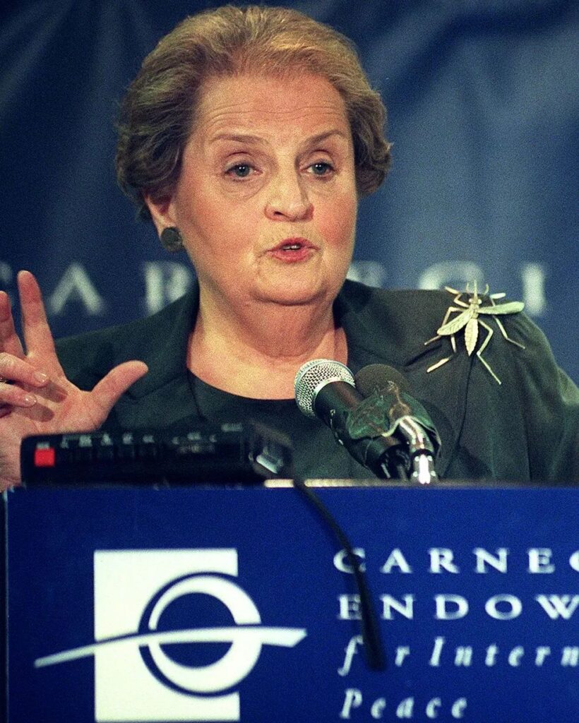 Madeleine K. Albright wearing a bug brooch