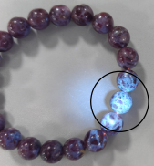 Sample appearance: Overall purple-red color with poor luster. Under ultraviolet light, the sample reveals a granular structure.