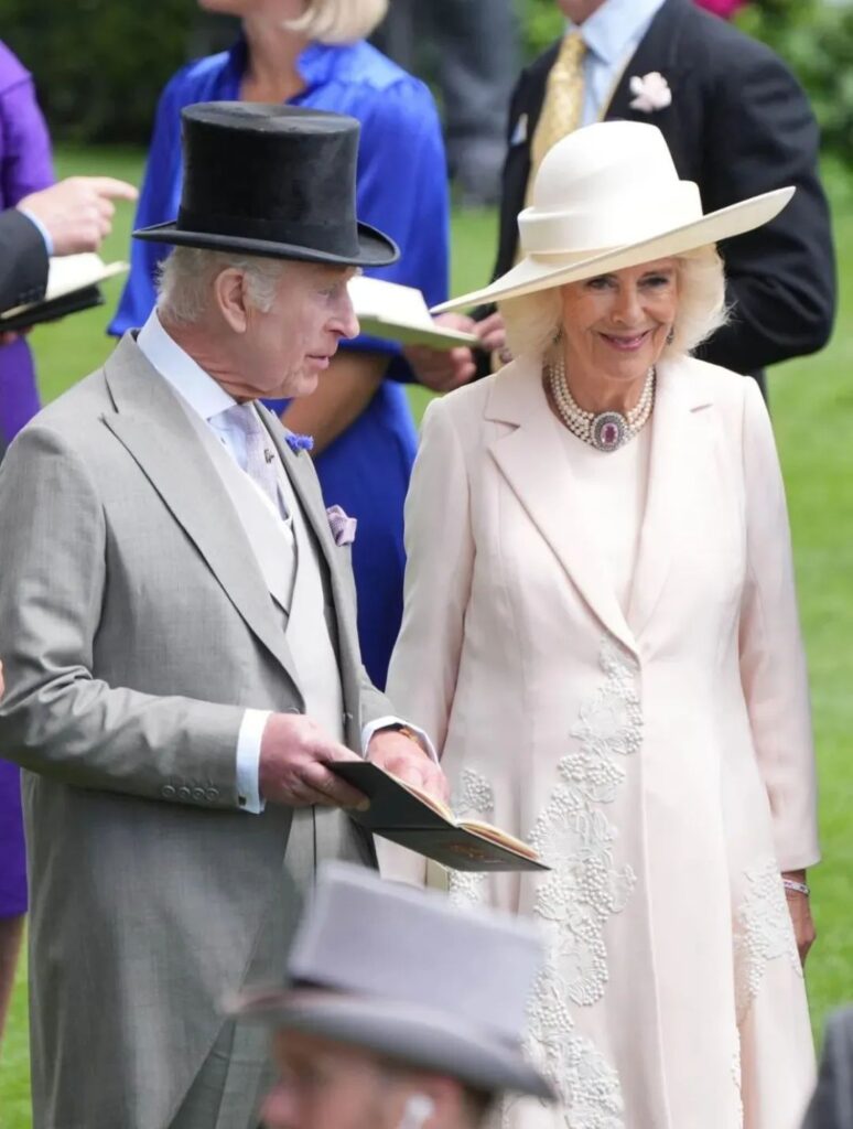 Camilla wearing the antique topaz brooch necklace.