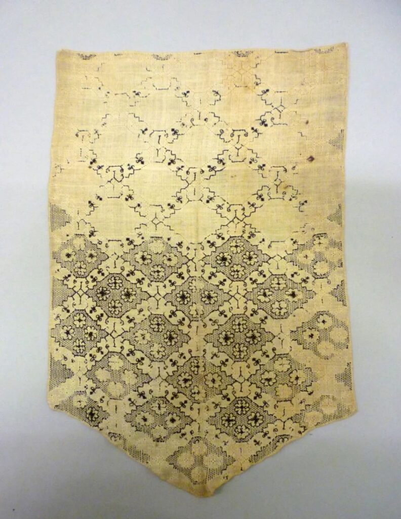 A 16th-century linen stomacher with black embroidery, now in the V&A Museum