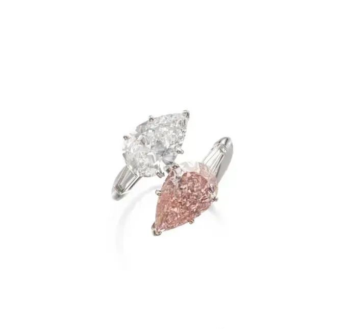 Toi et moi ring with a 5.01-carat pear-shaped fancy orangy pink diamond and a 4.02-carat pear-shaped diamond.