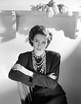 Babe Paley wearing a baroque pearl necklace