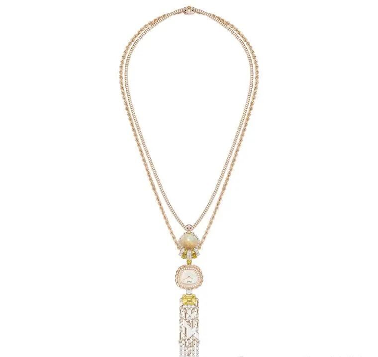 Piaget's design features two gold chains, a round opal set with white and yellow gems, and a detachable dial.