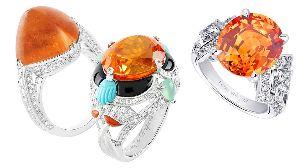 From left to right:
Boucheron Joy Ring
Mandarin garnet, diamonds
Van Cleef & Arpels Ring
Diamonds, turquoise, coral, chrysoprase, banded agate, mandarin garnet
Louis Vuitton Acte V Genesis Ring
Mandarin garnet, diamonds