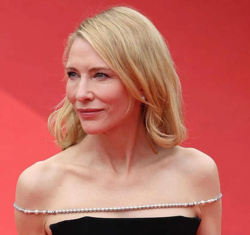 The shoulder chain worn by Cate Blanchett, designed by Louis Vuitton and crafted from pearls and diamonds repurposed from existing jewelry, demonstrates the role of sustainability in luxury jewelry.