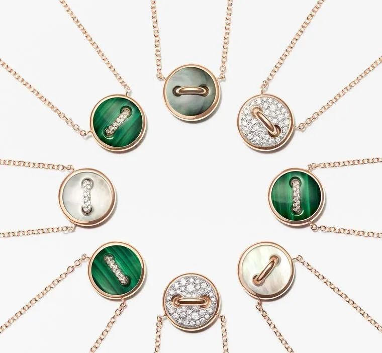 Pomellato's Pom Pom Dot jewelry offers three striking convertible pieces. The first features green malachite and mother-of-pearl, the second white diamonds and mother-of-pearl, and the third grey and white mother-of-pearl.