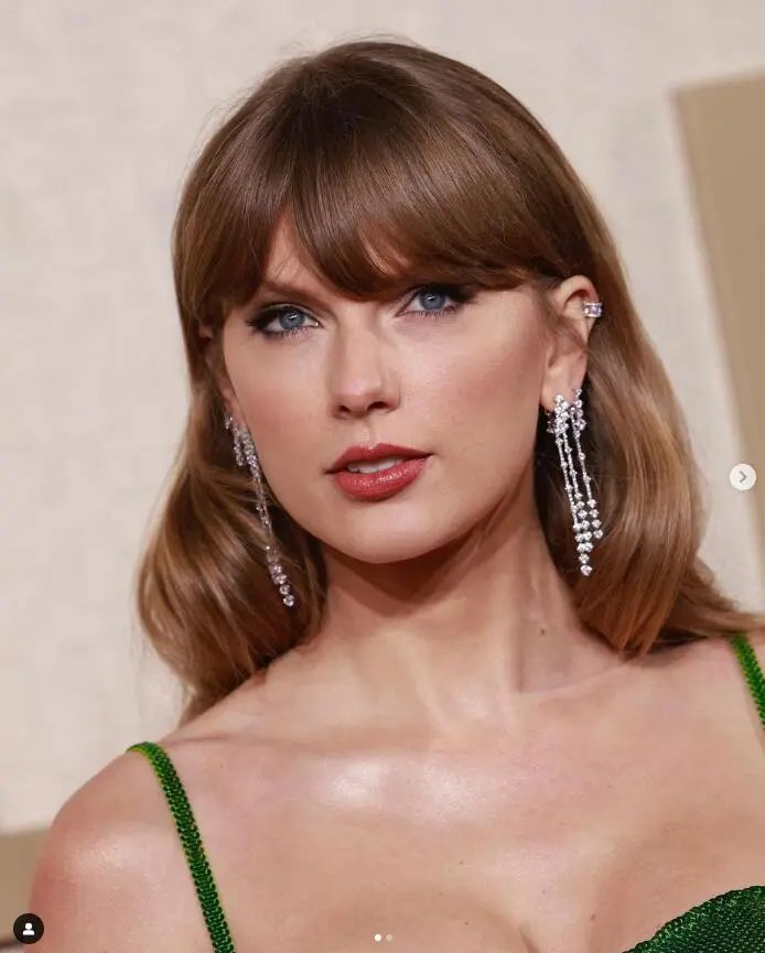 Taylor Swift wearing De Beers earrings