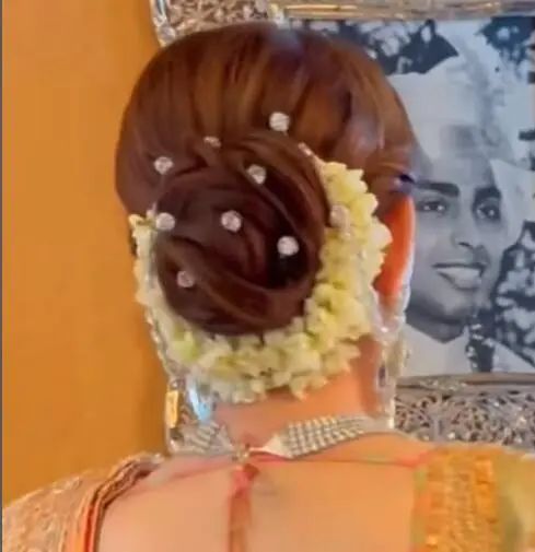 Nita Ambani's bun adorned with large single diamonds