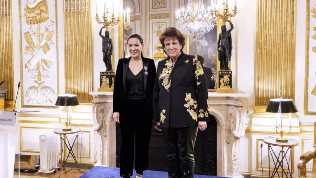 French Minister of Culture, Roselyne Bachelot (right), personally presenting the Chevalier de l'Ordre des Arts et des Lettres to jewelry artist Cindy Chao (left)