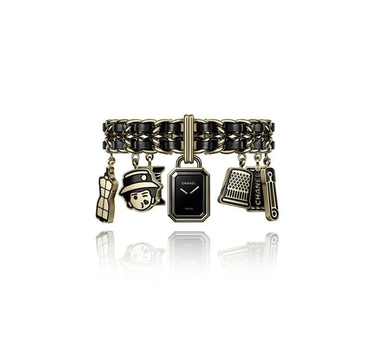 The Première Charms Haute Couture watch is characterized by charms attached to a braided leather bracelet, echoing the iconic Chanel bag chain.