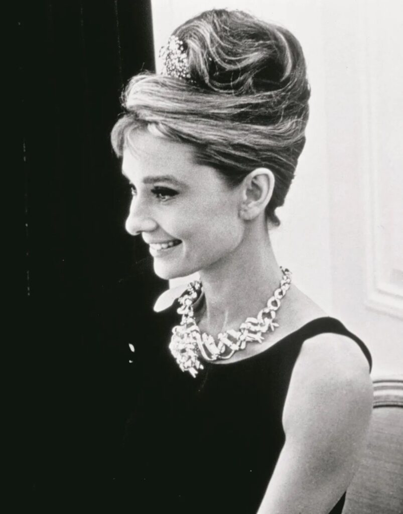 Audrey Hepburn 
wearing the legendary Tiffany Yellow Diamond Ribbon Necklace 
designed by Jean Schlumberger