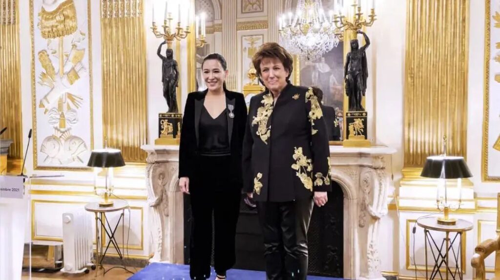 French Minister of Culture Roselyne Bachelot (right) personally awarding the French Ordre des Arts et des Lettres to jewelry artist Cindy Chao (left)