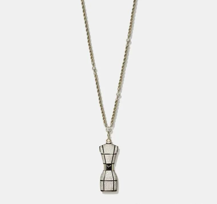 Chanel's bust-length necklace showcases a diamond-encrusted miniature tailor's mannequin suspended on a gold chain, which slides open at the waist to reveal a hidden dial. Limited to twenty pieces.