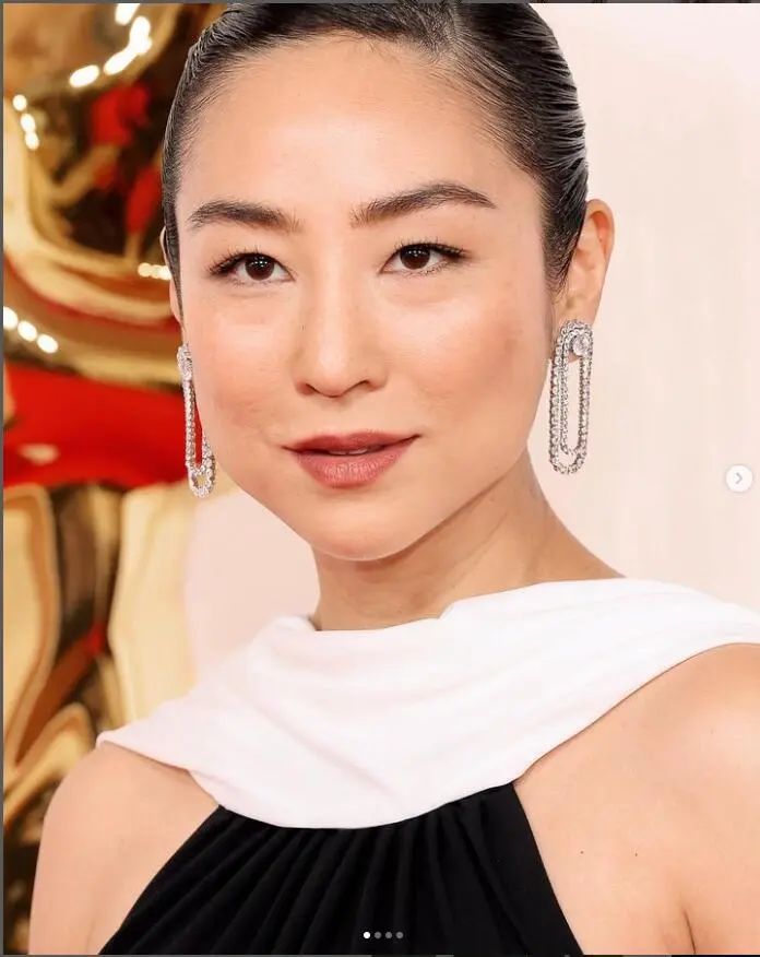 Greta Lee wearing Tiffany jewelry