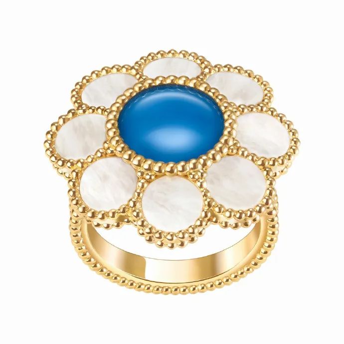 Pâquerette gold rings by Van Cleef & Arpels
A yellow gold ring adorned with custom-cut blue agate and white mother-of-pearl.