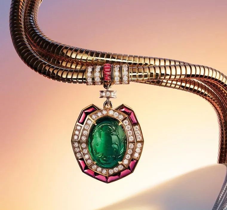 Bvlgari's Terra Mater Serpenti necklace is characterized by a diamond and emerald snake wrapped around a huge round emerald.