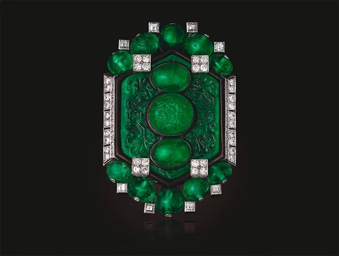 Cartier-designed Art Deco emerald, diamond, and enamel brooch