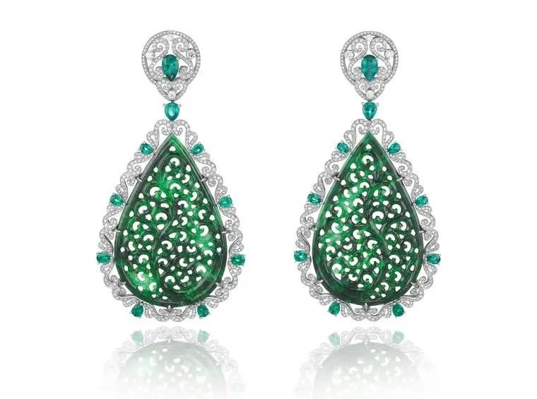 Chopard white gold earrings, featuring two carved jadeites totaling 45 carats, pear-shaped emeralds, and diamonds