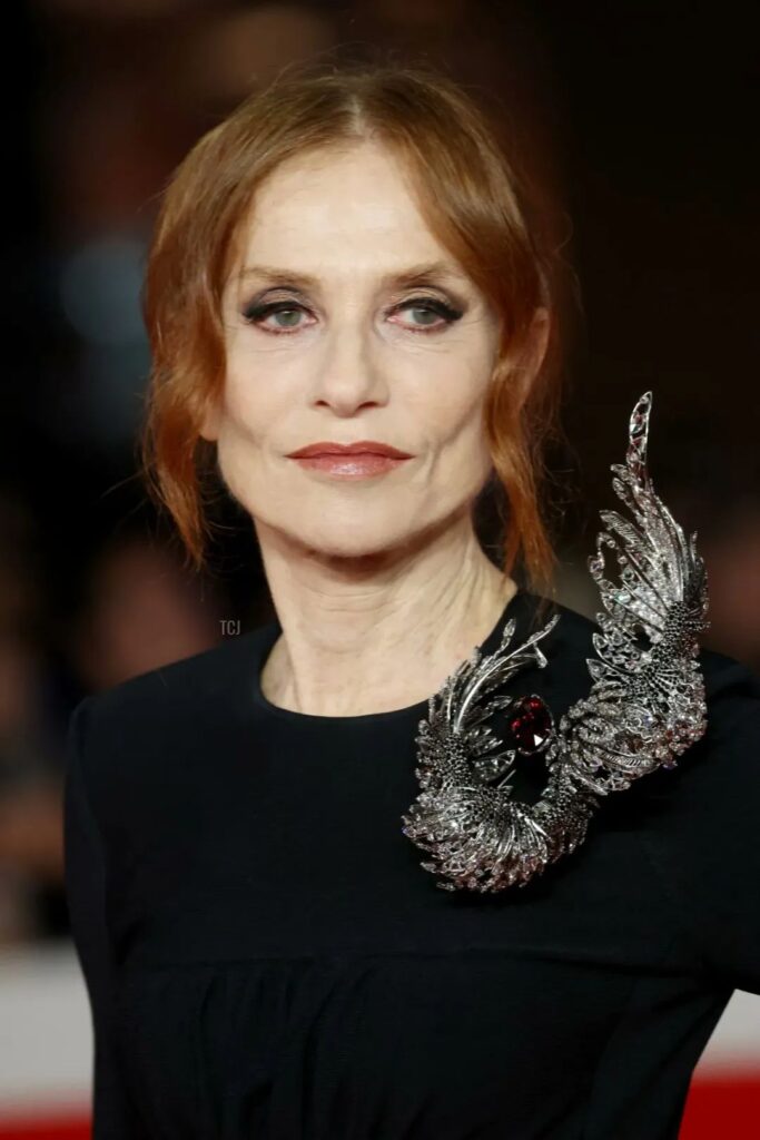 Isabelle Huppert wearing an Elsa Jin oversized brooch