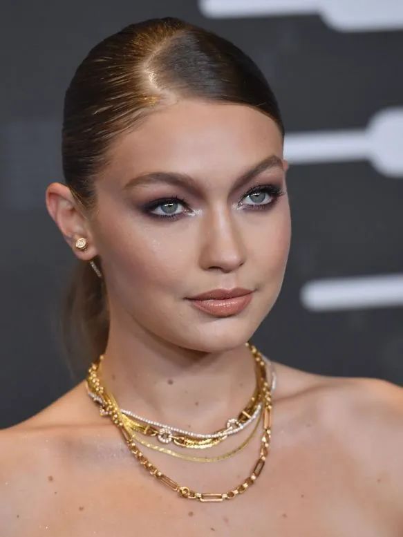 Gigi Hadid layering chain necklaces