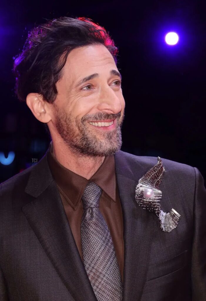 Adrien Brody wearing an Elsa Jin oversized brooch