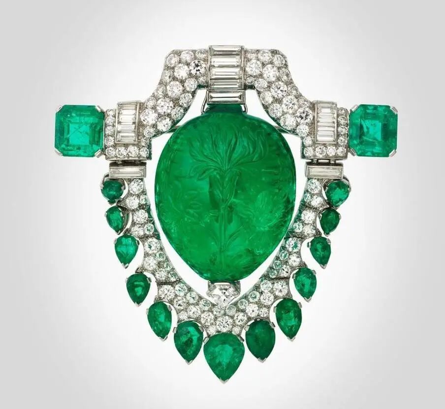 Marjorie Merriweather Post's emerald brooch designed by Oscar Heyman & Brothers in the 1920s, featuring a 17th-century Mughal carved emerald as the main stone