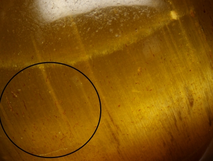 Magnified inspection: Obvious color residue can be seen in surface depressions.