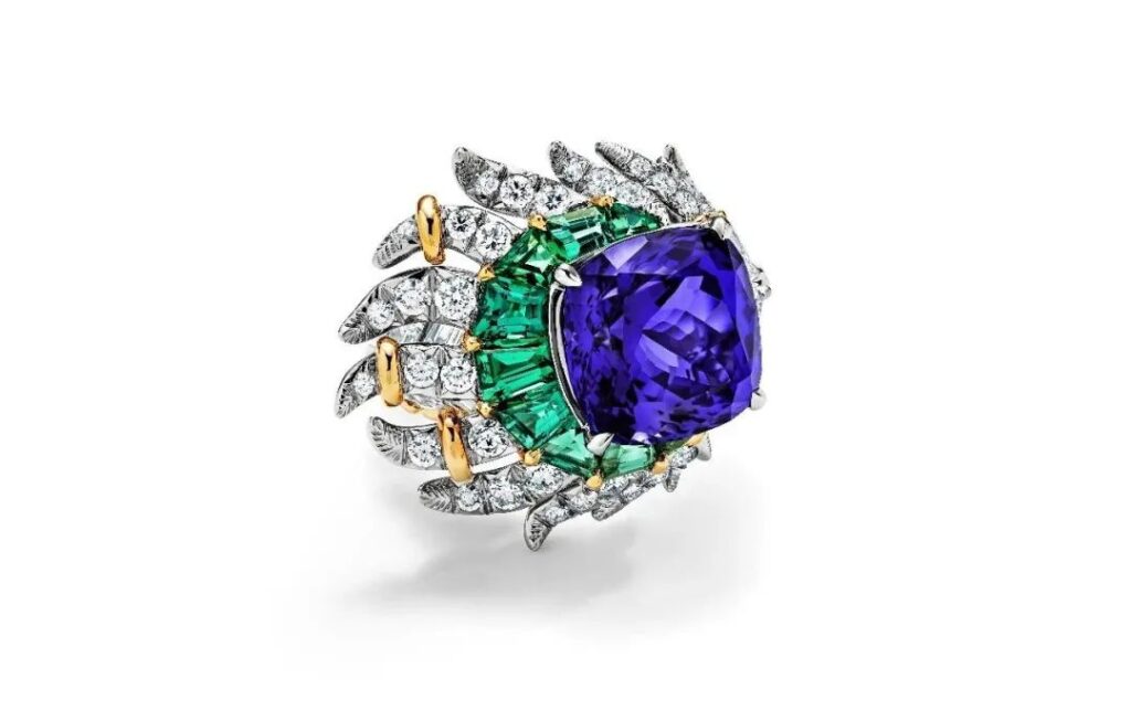 Tiffany's "2024 Blue Book High Jewelry"
"Celestial Wonders" Collection, "Peacock" Theme
Platinum and 18K yellow gold ring set with cushion-cut tanzanites, green tourmalines, and diamonds
Featuring a single cushion-cut tanzanite weighing over 11 carats