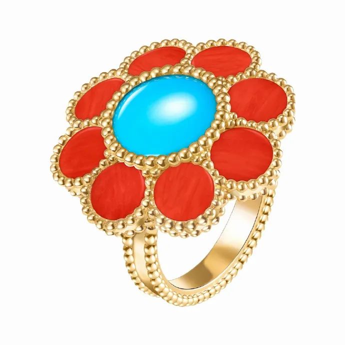 Pâquerette gold rings by Van Cleef & Arpels
A yellow gold ring featuring custom-cut turquoise and coral.