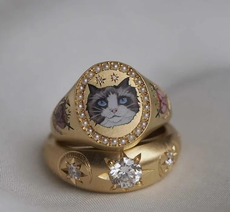 Cece's signet ring design for Taylor Swift is pictured alongside an engagement ring. Is this a hint from the designer to Kelce?