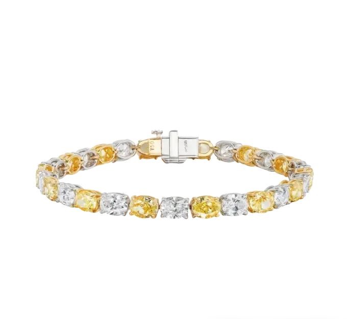 Platinum, yellow gold, fancy yellow diamond and diamond bracelet.