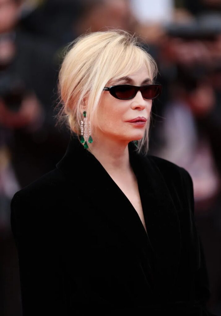 Emmanuelle Béart wearing Chopard emerald earrings