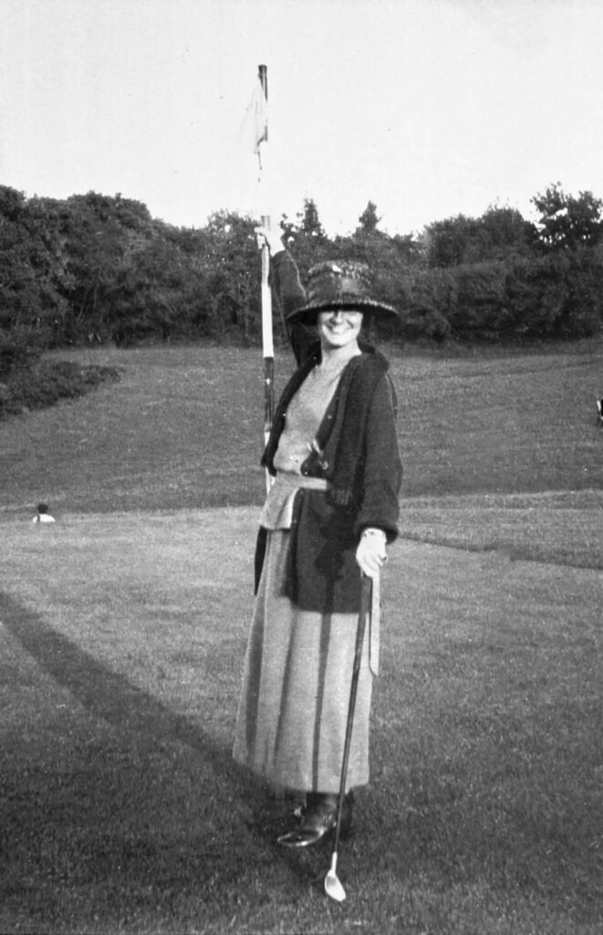 Coco Chanel wearing her own loose-fitting women's clothing design
On a golf course