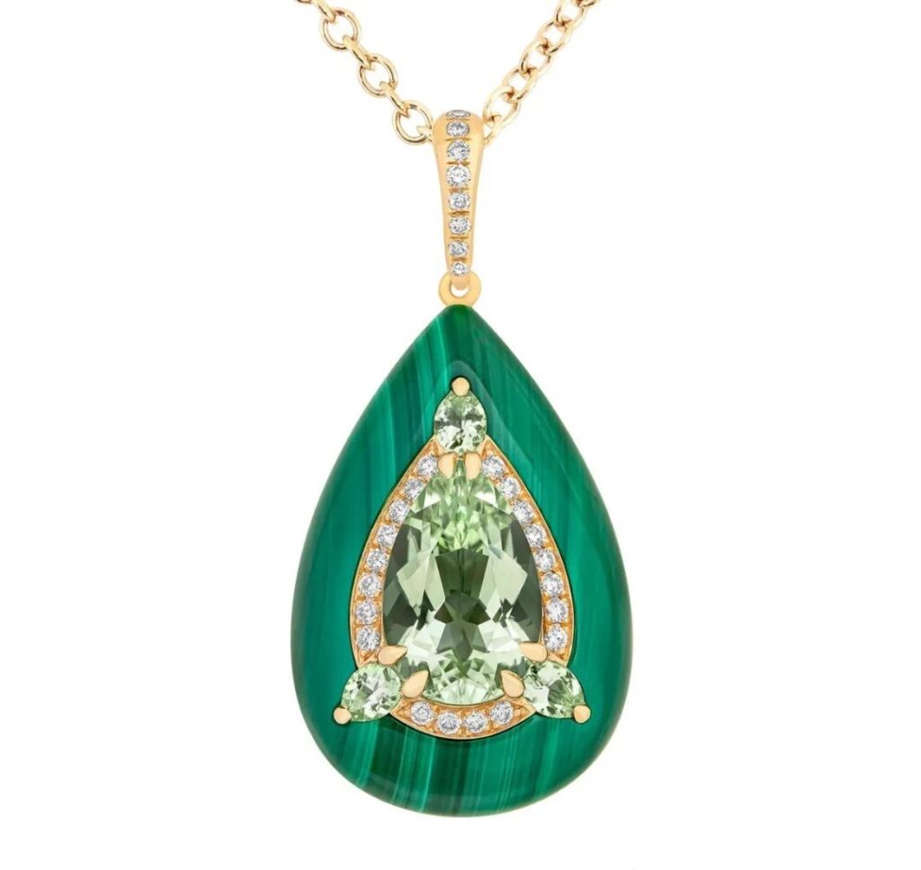 Inlay Reveal Gold Pendant, by Boghossian
Set with one 2.6ct pear-cut green tourmaline, one 23.05ct pear-cut malachite, three pear-cut green tourmalines, and round brilliant-cut diamonds.