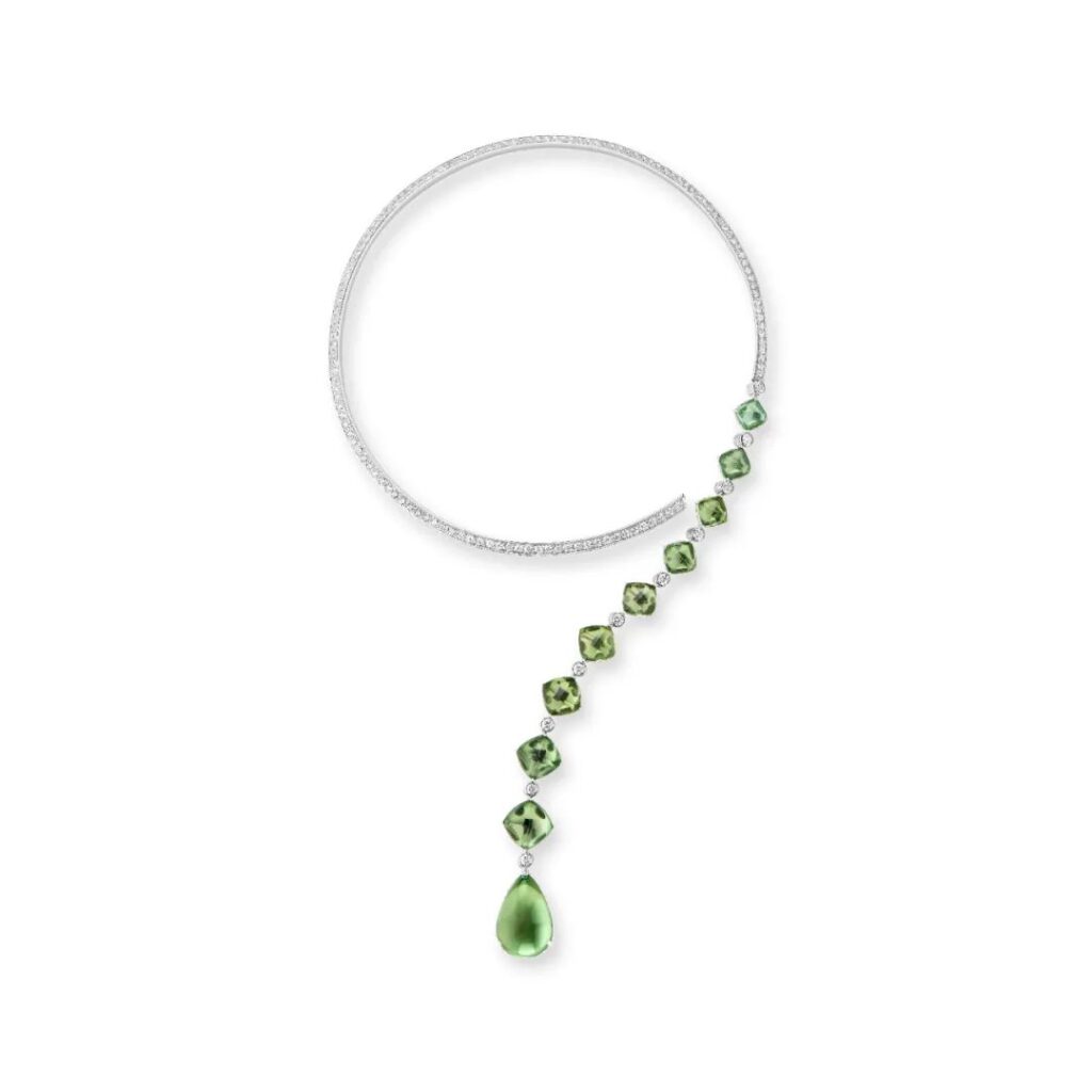 Goutte Question Mark Necklace: Crafted in white gold, set with 9 sugar-loaf cut green tourmalines and 1 pear-shaped green tourmaline (total weight 44.81 carats) and crystal, pavé-set with diamonds.