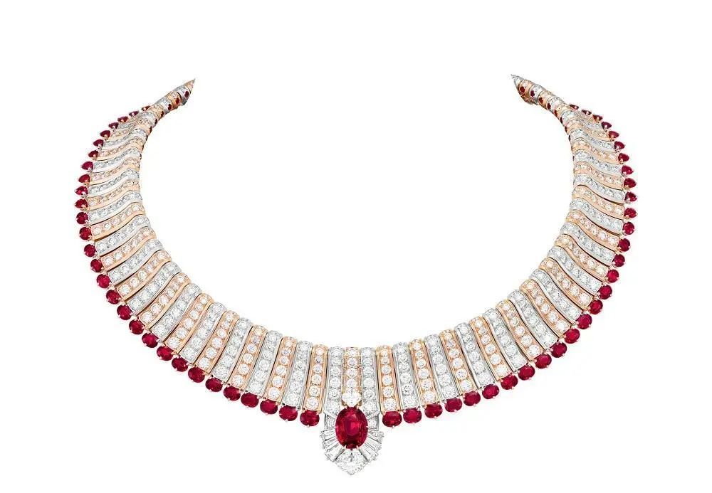 Andaakar white gold necklace, by Van Cleef & Arpels
Main stone is a 5.03ct oval-cut ruby
Set with a 1.21ct oval-cut diamond below, graded E color and VVS1 clarity
Accented with small rubies and diamonds
