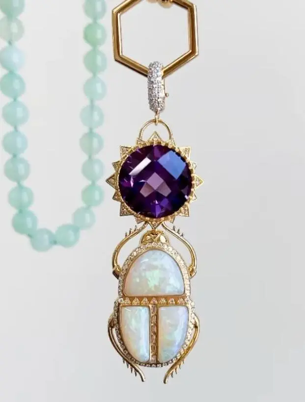 Harwell Godfrey's scarab pendant features white gold, yellow gold, amethyst, opal, and diamonds