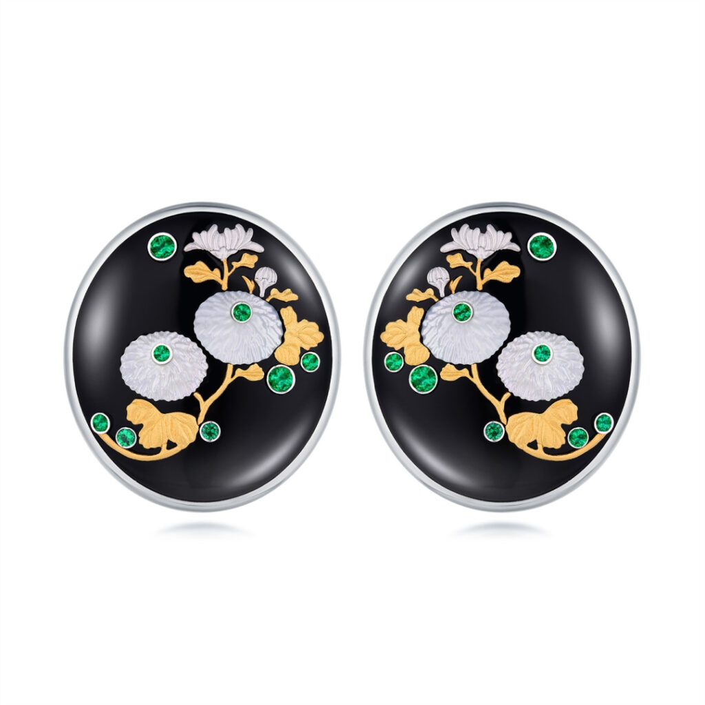 The "Window Harbors Autumn Blooms" gold earrings by MidnightOperaHouse X Gemfields are set with 16 round-cut emeralds, certified to be from Zambia, along with black onyx and mother-of-pearl.