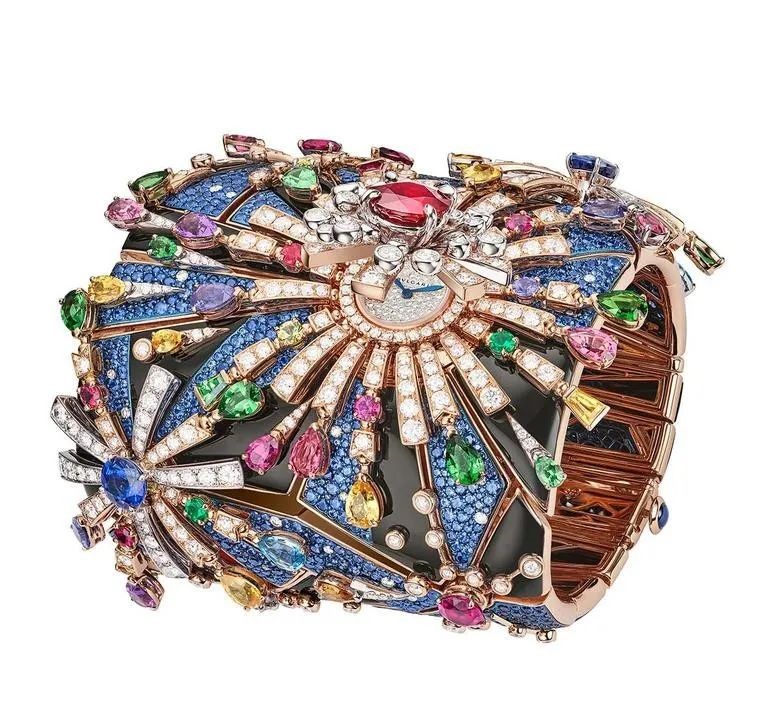 Bvlgari spent over 1,450 hours creating the Fuochi D'artificio high jewelry Manchette, featuring rose gold, blue titanium, colored gemstones, and diamonds depicting vibrant fireworks.