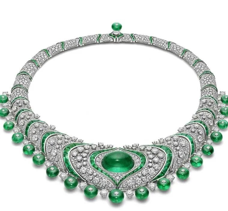 In this emerald lotus necklace, the lotus motif centers around a 37.14-carat Maharaja emerald. Diamonds and emeralds surround the centerpiece in this highly symbolic design that took 2,200 hours to complete.