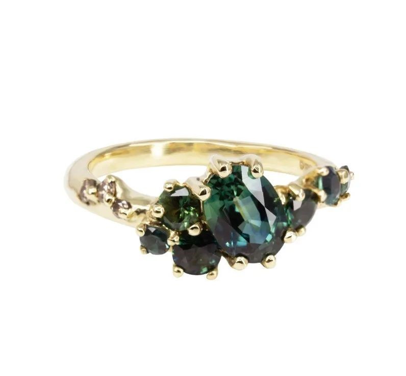 Dryad V gold ring, by Irena Chmura.
Set with oval and round-cut green sapphires, accented with diamonds.