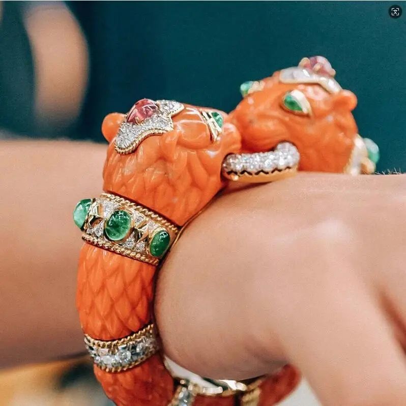 David Webb coral-carved double lion head bangle