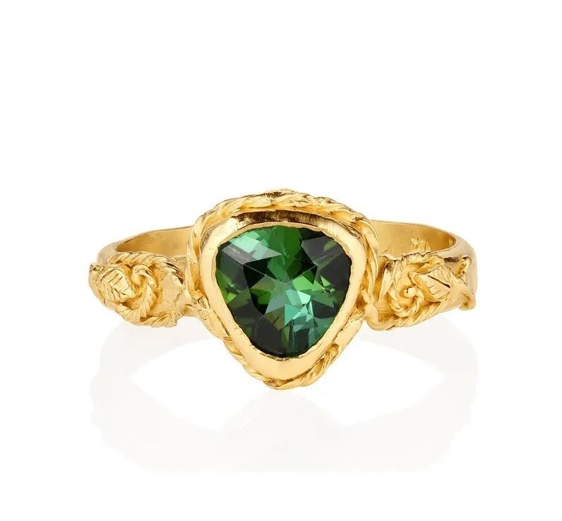 Interlaced gold ring, by Evangeline Porche.
The center stone is a green tourmaline.